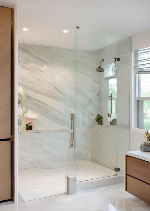 Modern Master Bathroom With A Seamless Frameless Glass Shower Creating An Open And Airy Atmosphere