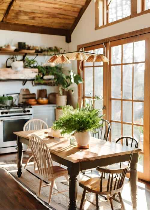 Farmhouse Kitchen With A Wooden Farmhouse Table And Mismatched Chairs